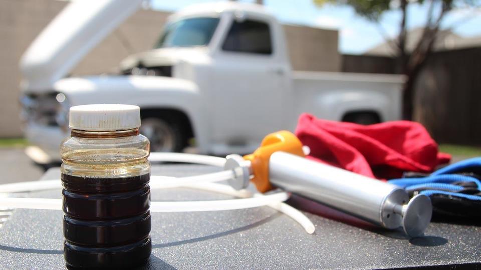 Used Oil Sample drawn using an Oil Extracting Pump